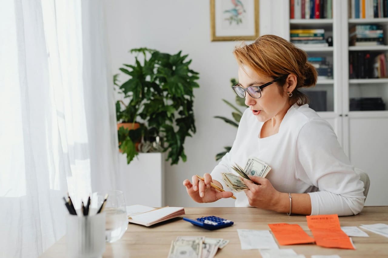 Image showing a woman planning finances for airbnb investment