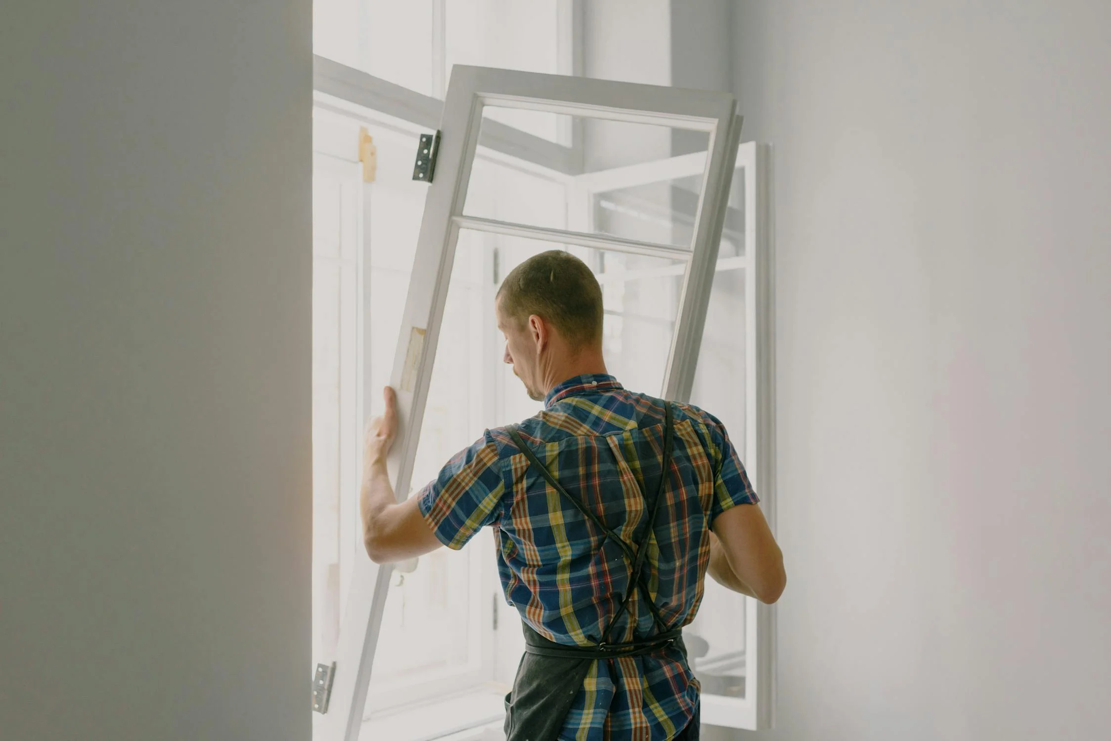 Image showing a man fixing a door in a vacation rental