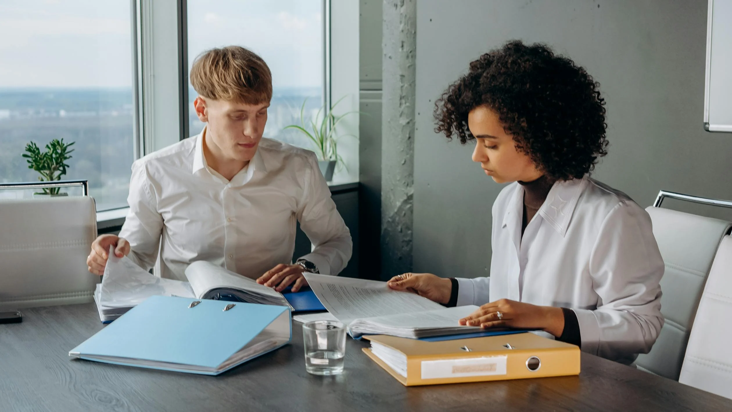 Image showing a man and woman going over a vacation rental management agreement