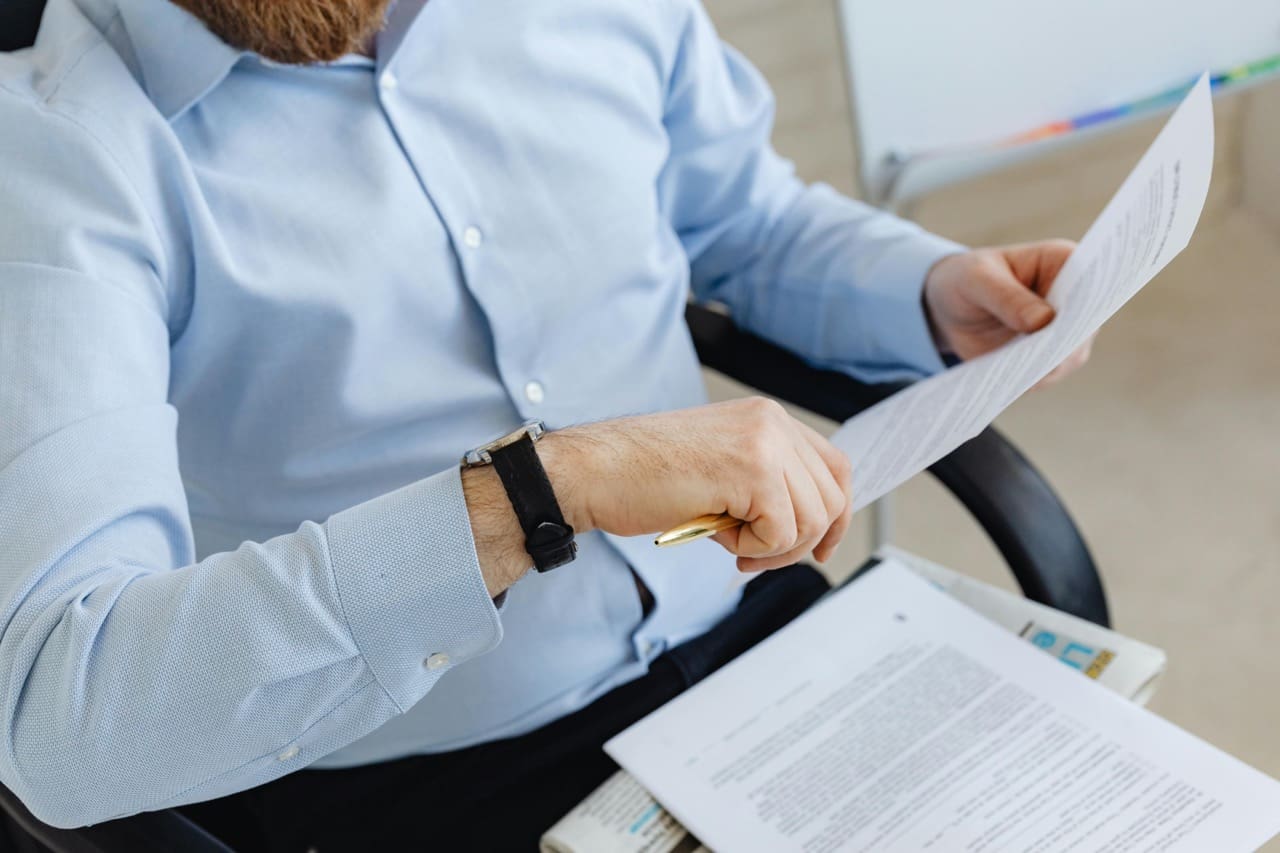 Image showing a man going through short term rental regulations in Dubai