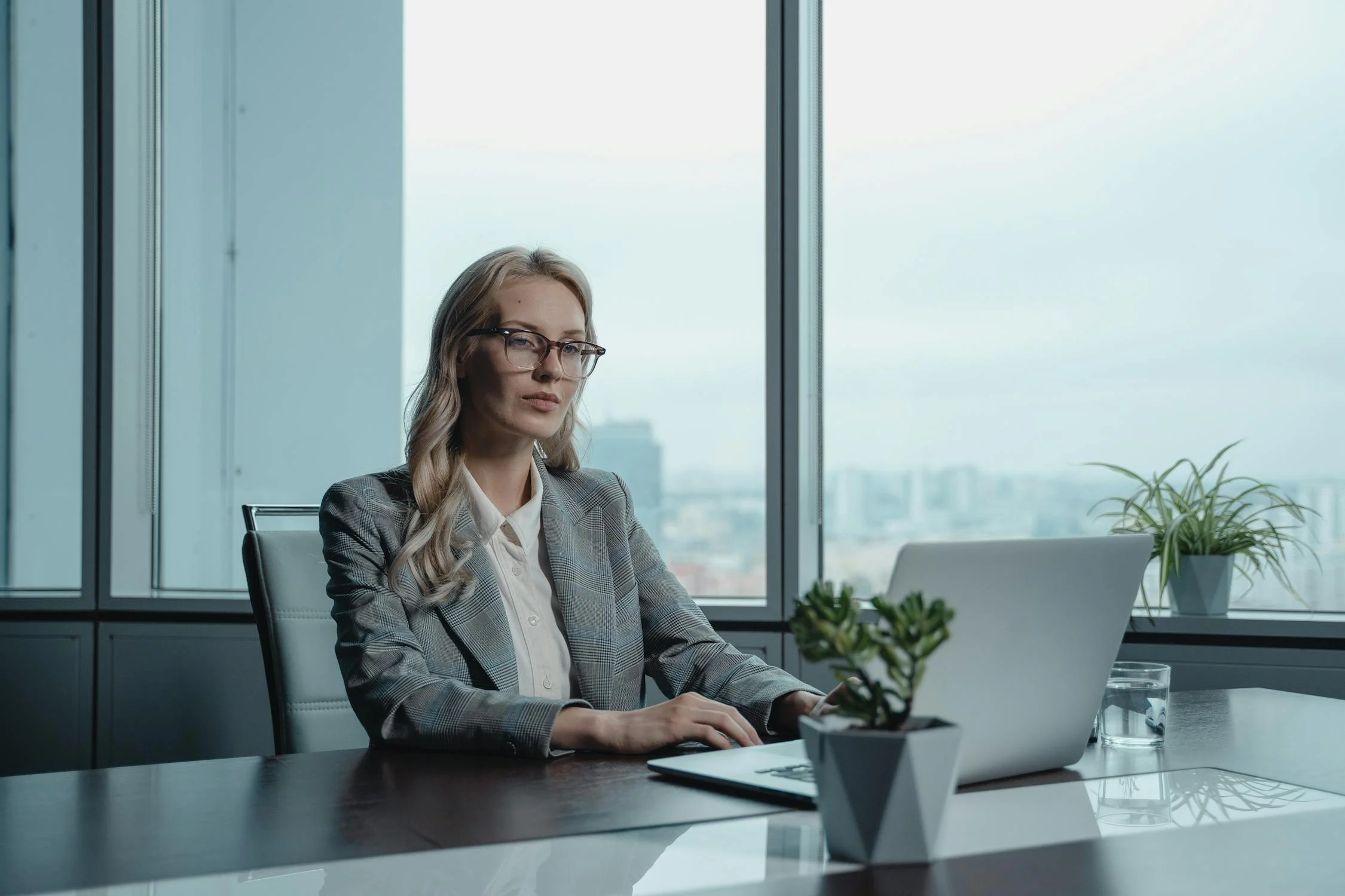 Image showing a lady trying to make a decision on her computer