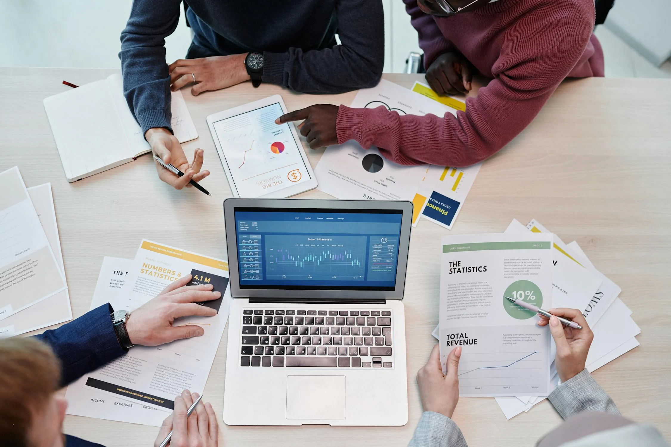 Picture showing a group of people calculating rental yield