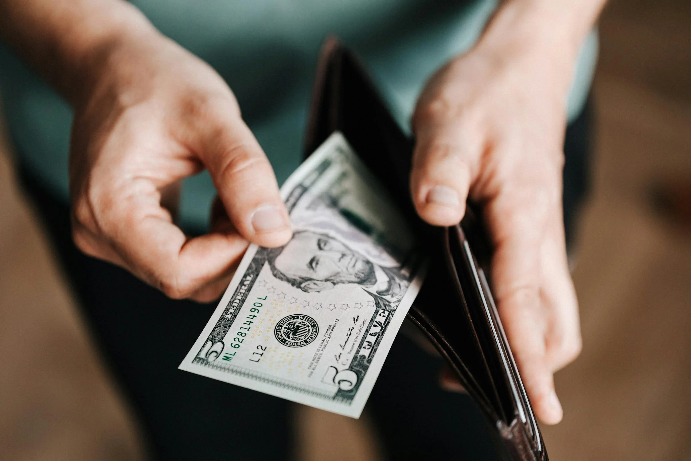 Image of a man counting cash