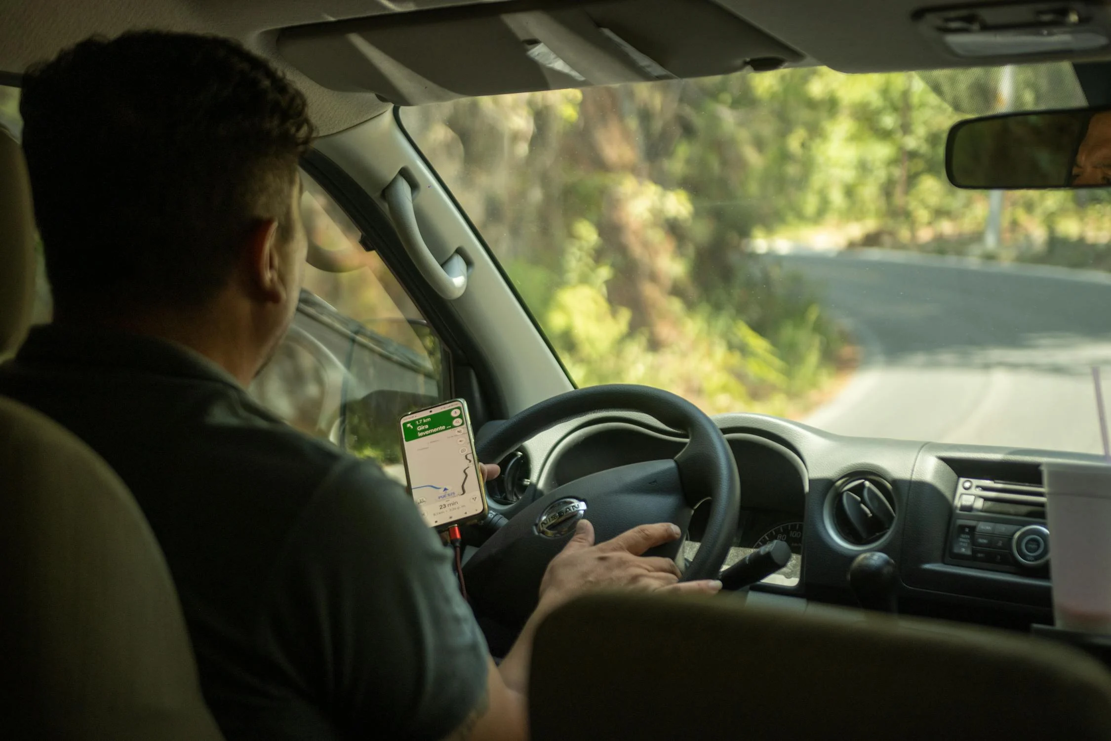 Image showing a driver navigating the streets of Jumeirah Village Circle, Dubai