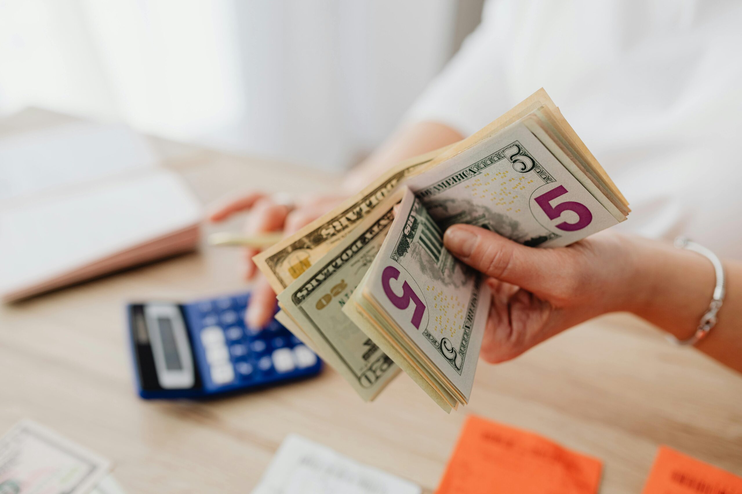 Photo of a property manager holding money