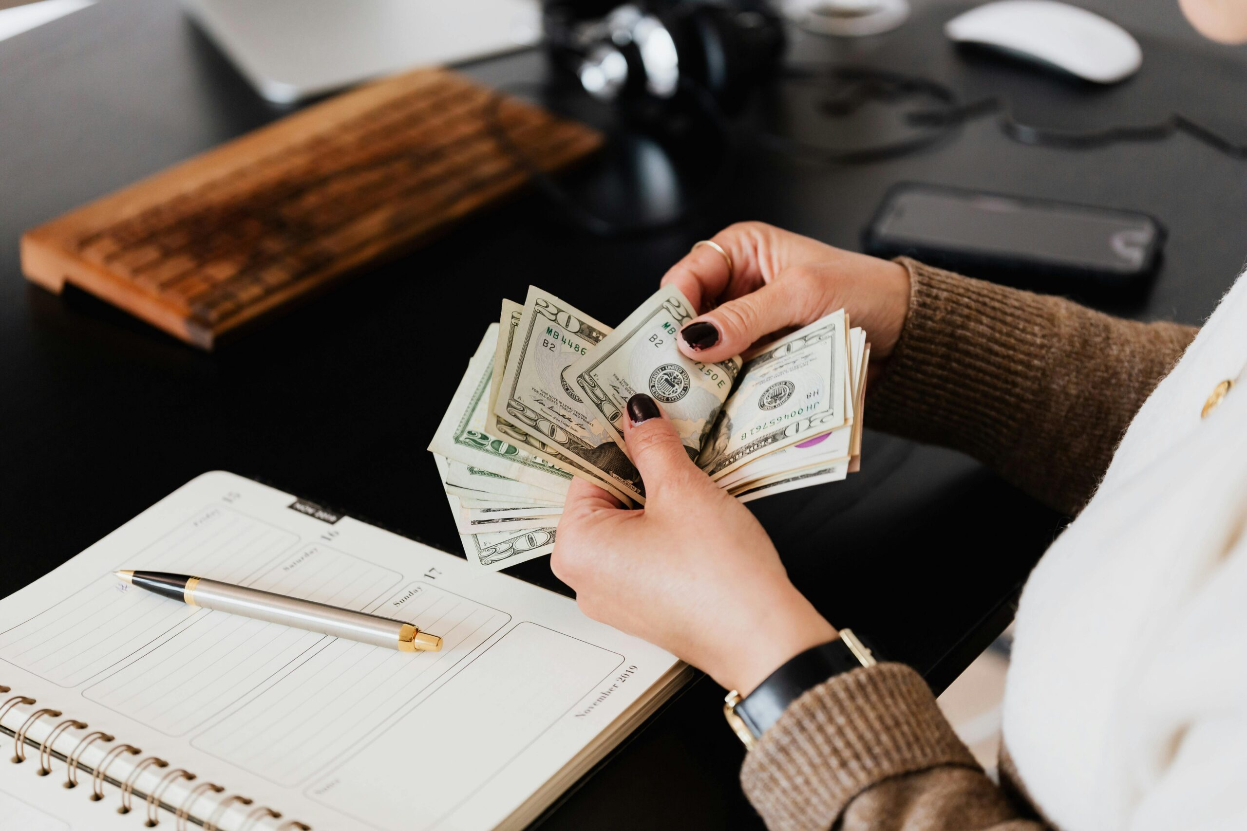 A GuestReady account manager reviewing rental earnings and calculating host payout