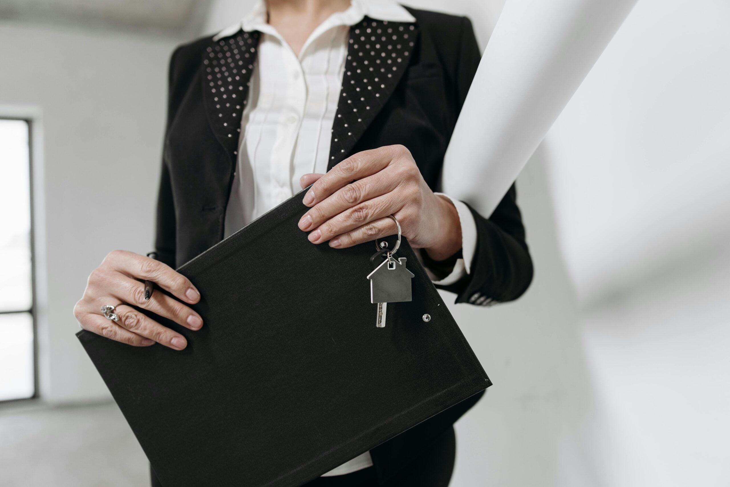 A close-up of a property manager holding a document 