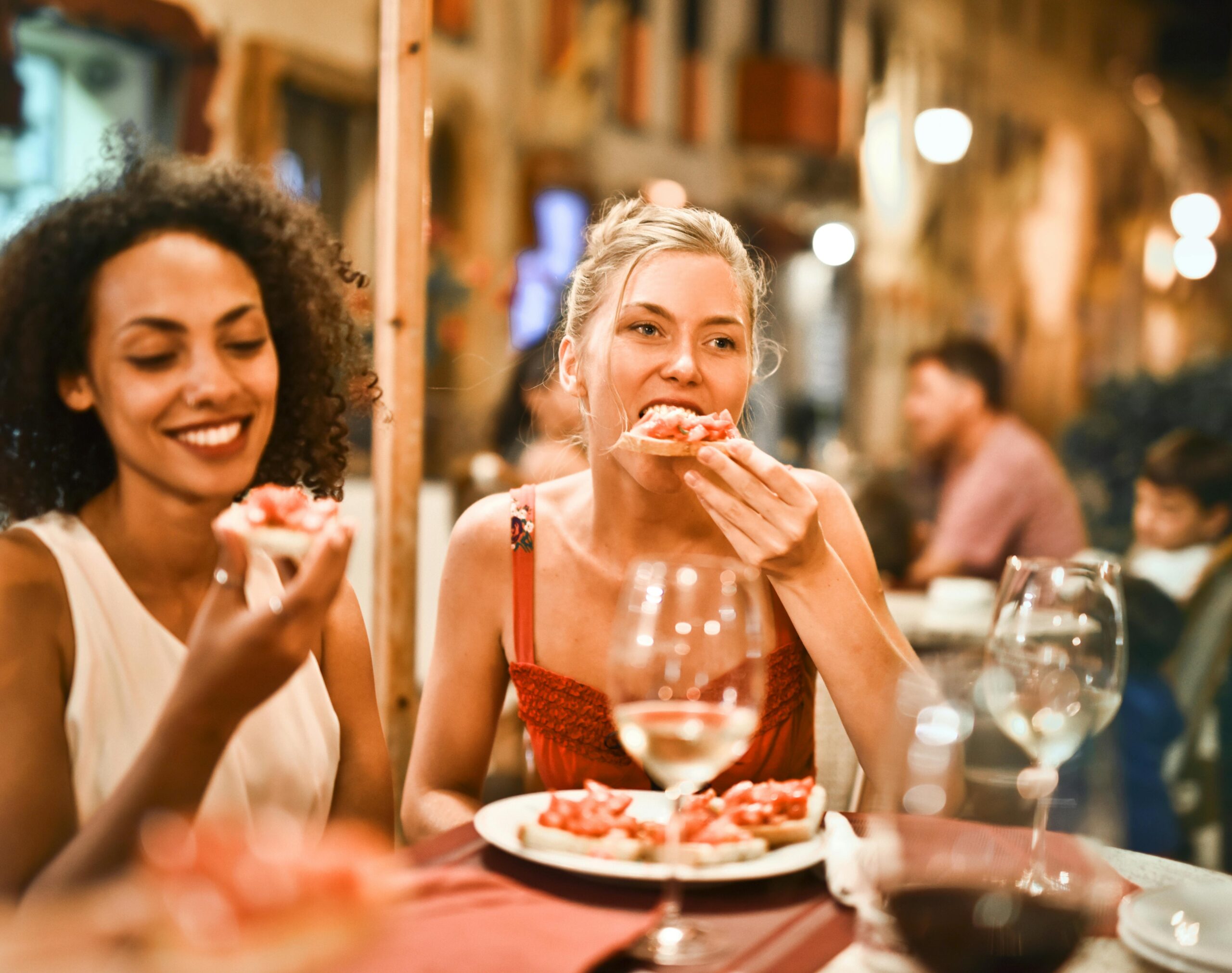 Photo with two women dining in a restaurant