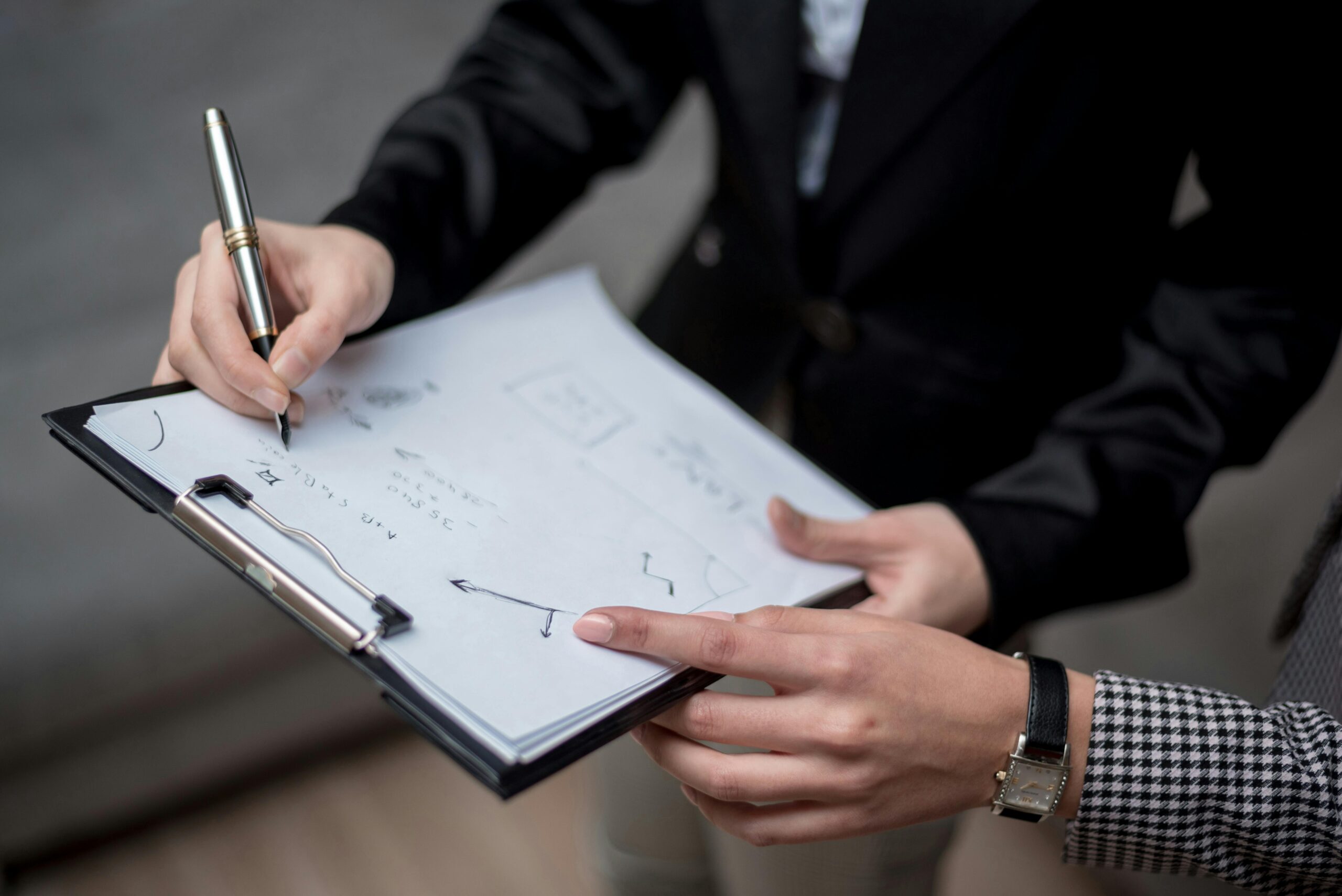 Investors looking at an investment chart during a meeting.