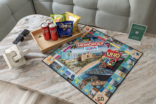 A welcome tray featuring light snacks and chilled drinks, ready for guest arrival.
